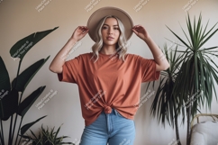 Woman wearing casual outfit with hat Product Image 1