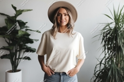 Woman wearing cream t shirt and hat image Product Image 1