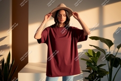 Woman wearing maroon t shirt and hat image Product Image 1