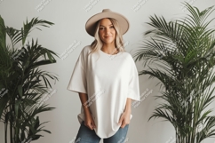Woman wearing oversized shirt and hat Product Image 1