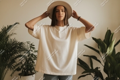 Woman wearing white t shirt and hat image Product Image 1