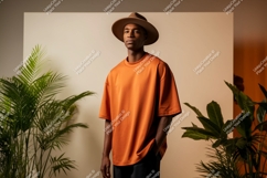 Man wearing orange t shirt and hat image Product Image 1