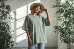 Woman wearing green t-shirt and hat Product Image 1