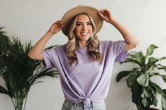 Woman wearing lavender t shirt and hat image Product Image 1