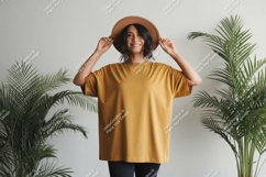 Woman wearing mustard t shirt and hat mockup Product Image 1