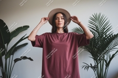 Woman wearing maroon t shirt and hat image Product Image 1