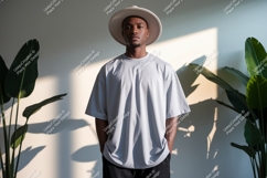 Man wearing light grey t shirt and hat image Product Image 1