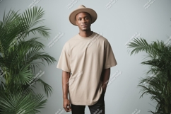 Man wearing beige t shirt and hat image Product Image 1