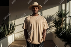 Man wearing tan t shirt and hat image Product Image 1