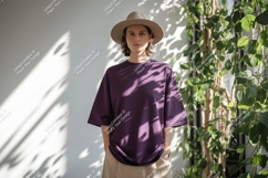 Woman wearing purple t shirt and hat image Product Image 1