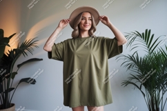 Woman wearing olive green t shirt and hat image Product Image 1