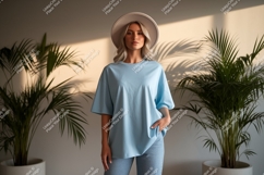 Woman wearing light blue t shirt and hat image Product Image 1
