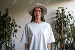 Woman wearing white t shirt and hat image Product Image 1
