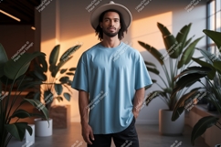 Man wearing blue t-shirt and hat plants Product Image 1
