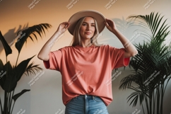Woman wearing coral t shirt and hat image Product Image 1