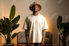 Man wearing beige t shirt and hat image Product Image 1
