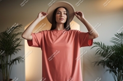 Woman wearing coral t shirt and straw hat image Product Image 1