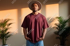 Man wearing maroon t shirt and hat image Product Image 1
