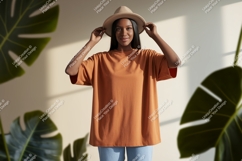 Woman wearing orange t shirt and hat image Product Image 1