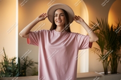 Woman wearing pink t-shirt and hat fashion Product Image 1