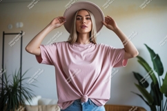Woman wearing pink t shirt and hat image Product Image 1