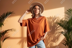Woman wearing oversized orange t shirt and hat image Product Image 1