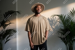 Man wearing tan t-shirt and hat black Product Image 1