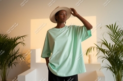 Woman wearing mint green t-shirt and hat image Product Image 1