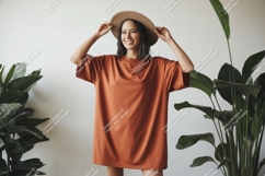 Woman wearing terracotta t shirt and hat image Product Image 1