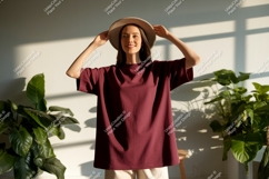 Woman wearing maroon t shirt and hat image Product Image 1
