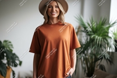 Woman wearing orange t shirt and hat image Product Image 1