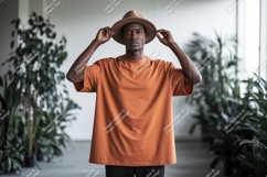 Man wearing orange t shirt and hat image Product Image 1