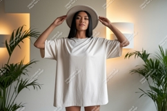 Woman wearing oversized t-shirt and hat indoor casual Product Image 1