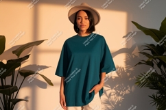 Woman wearing teal t-shirt and hat plants Product Image 1