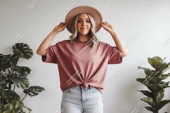 Woman wearing pink t shirt and hat image Product Image 1