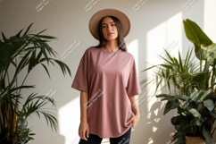 Woman wearing dusty rose t shirt and hat image Product Image 1