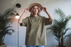 Woman wearing olive green t shirt and hat image Product Image 1