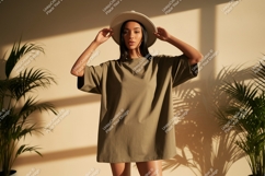Woman wearing oversized t shirt and hat fashion Product Image 1