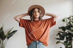 Woman wearing terracotta t shirt and hat image Product Image 1