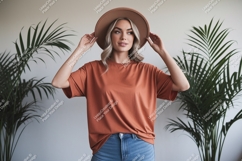 Woman wearing terracotta t shirt and hat image Product Image 1