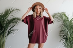 Woman wearing maroon t shirt and brown hat image Product Image 1