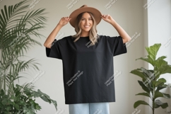 Woman wearing black t shirt and hat image Product Image 1