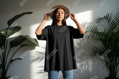 Woman wearing black t shirt and hat image Product Image 1
