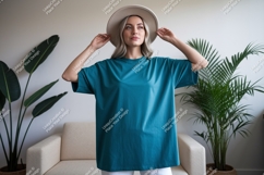 Woman wearing teal t shirt and hat image Product Image 1