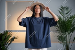 Woman wearing navy t-shirt and hat plant Product Image 1