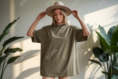 Woman wearing olive green t shirt and hat image Product Image 1