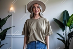 Woman wearing tan t shirt and hat image Product Image 1