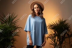 Woman wearing blue t shirt and hat image Product Image 1