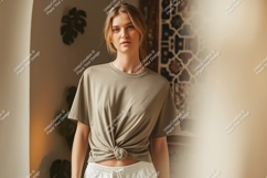Woman wearing a knotted olive green t shirt t-shirt Product Image 1