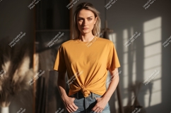 Woman wearing mustard yellow t shirt and deni Product Image 1